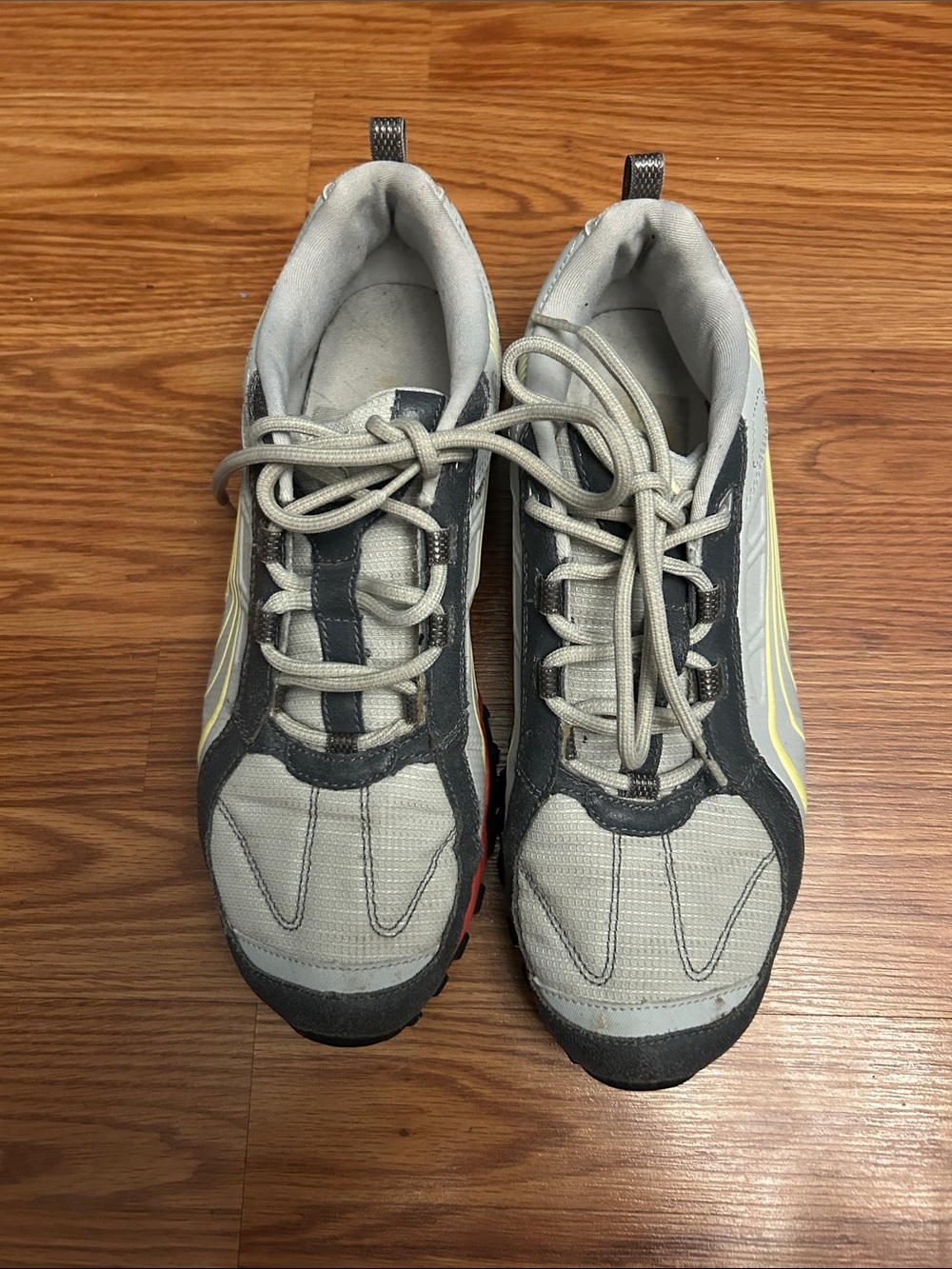 Puma Light and Dark Gray Sneakers with Yellow and Orange Accents